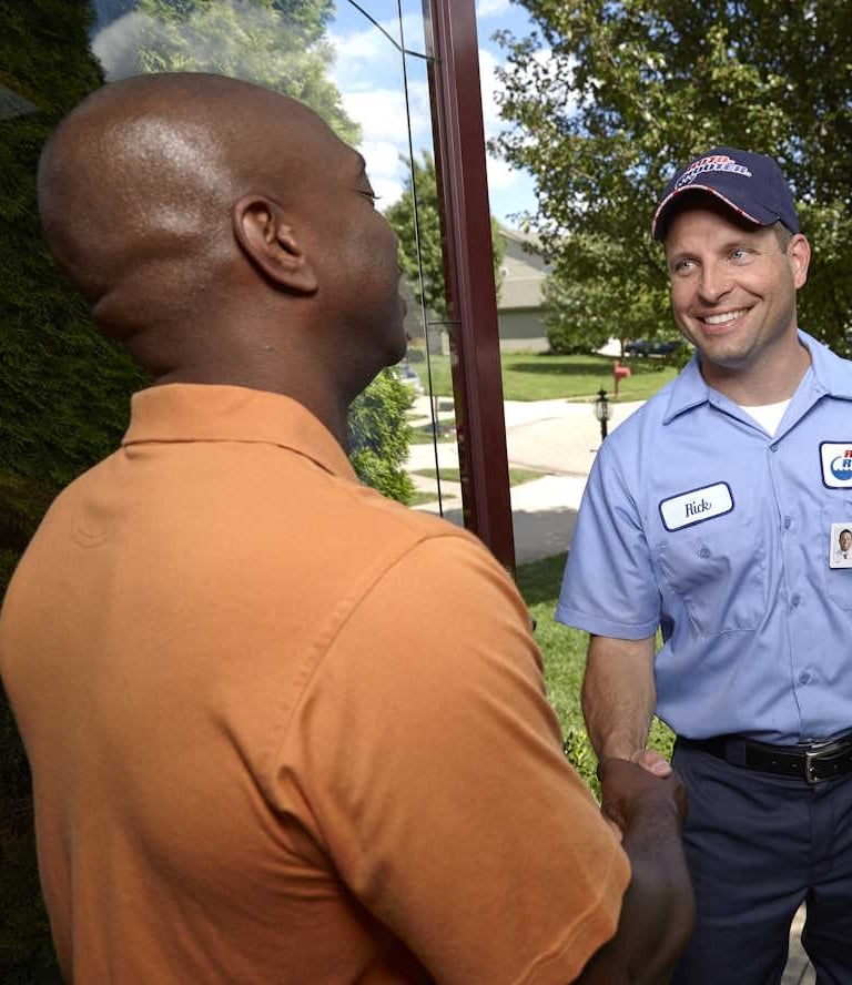 Roto-Rooter Tech Meets Client at His Residence