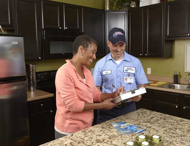 Roto-Rooter Technician Collecting Signature For Service Order