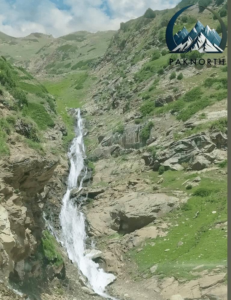 Water stream flowing down by a mountain