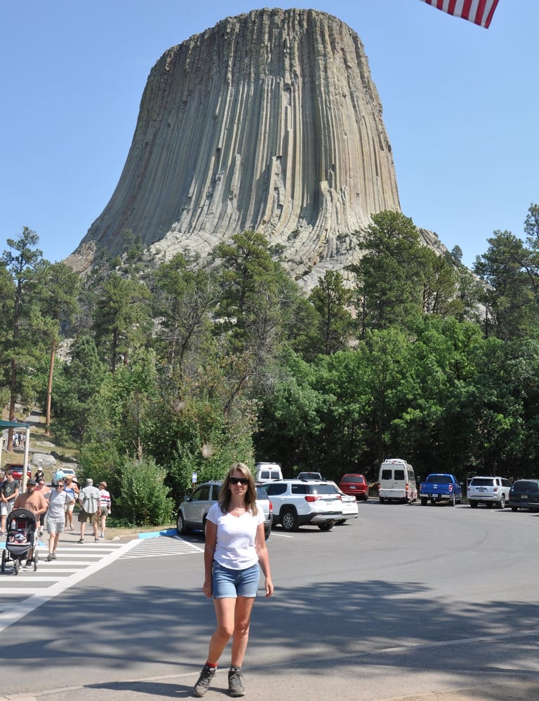 a woman at devils tower, wyoming