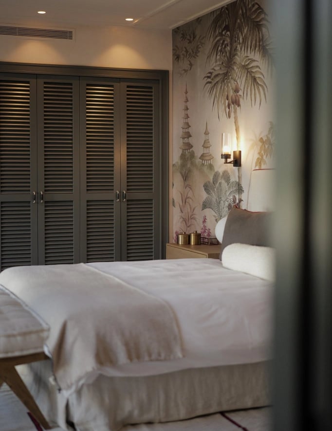 Bedroom at Villa La Gratitud with natural textures and warm lighting