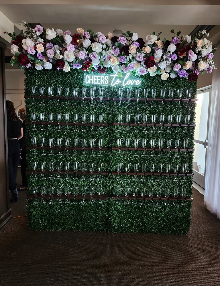 champagne walll burgundy themed floral arrangement
