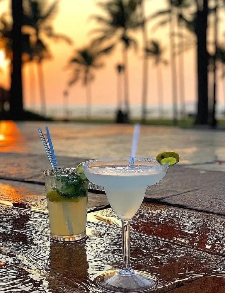 two cocktails with a view of the ocean