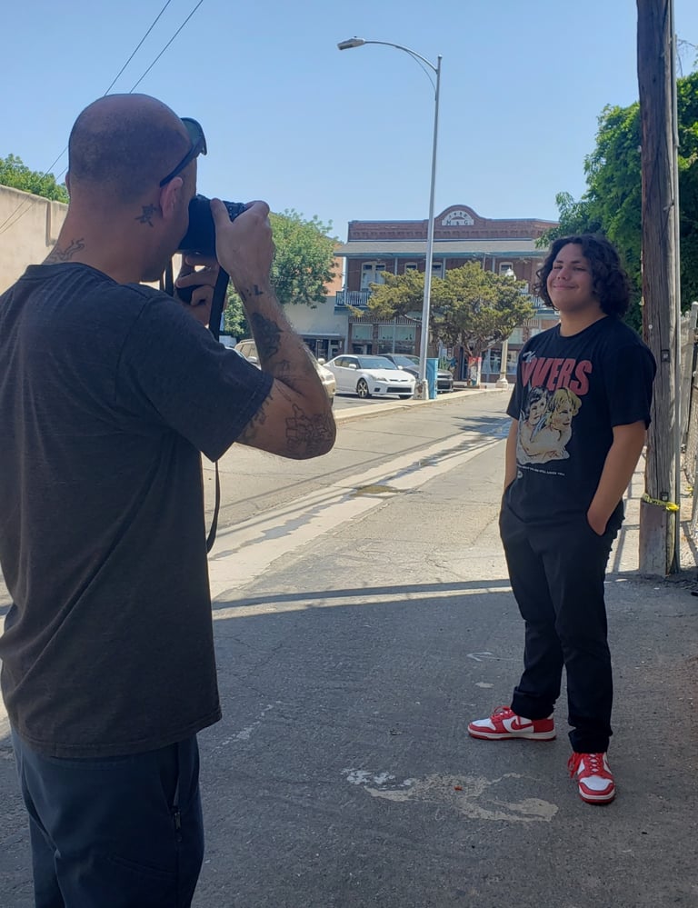 Taking a picture of a client in alley