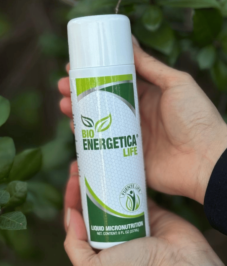 Bioenergetica Life liquid micronutrition bottle held in hand, daily natural energy and wellness supp