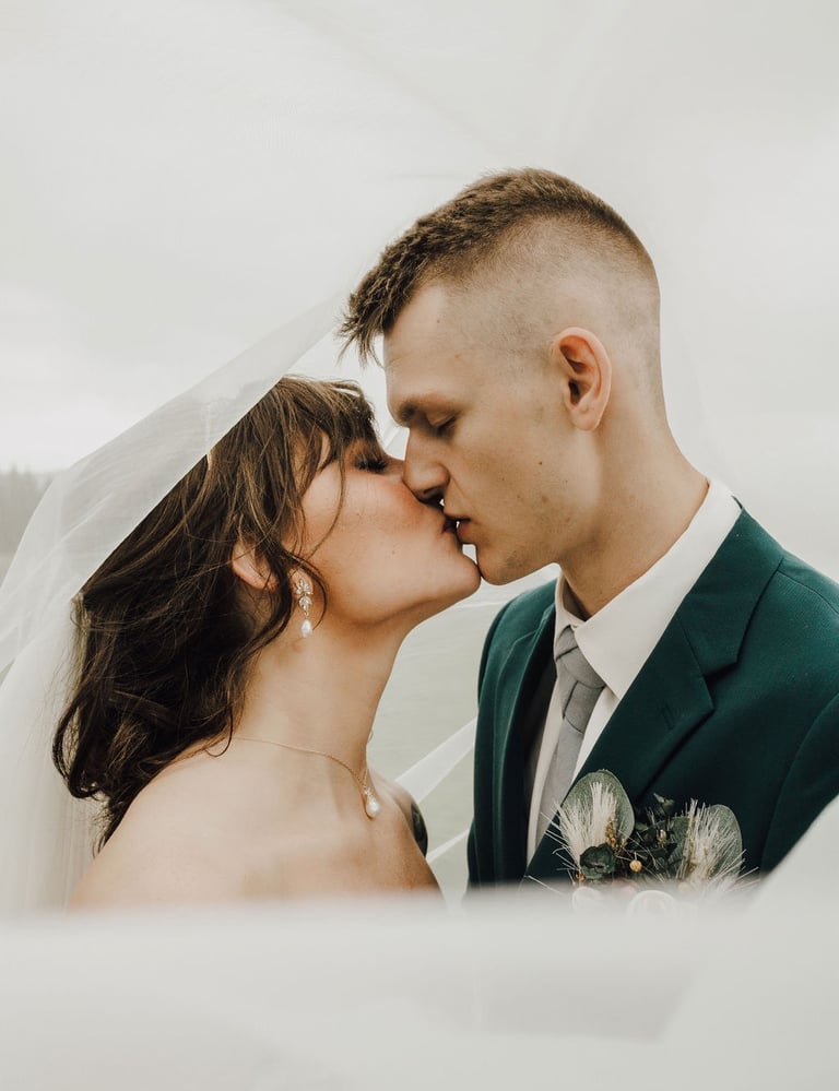 bride and groom portrait, kissing, under the veil shot