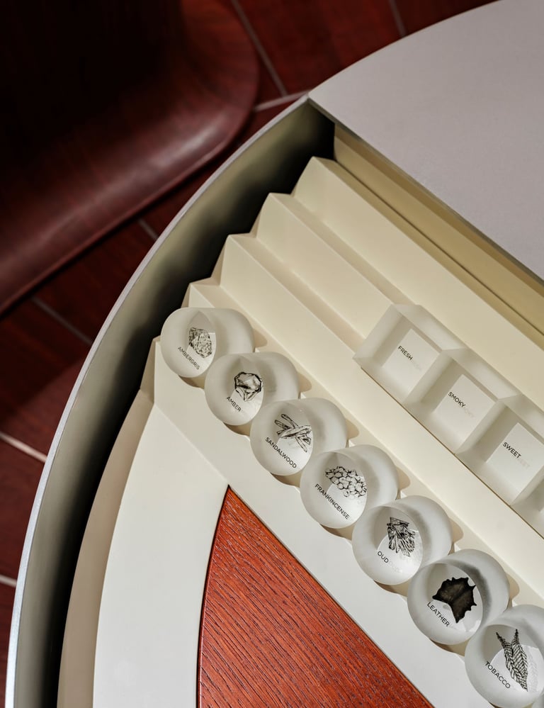 Amouage fragrance ingredients sampling display.