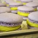 Artisanal French macarons, featuring delicate shells and creamy passion fruit ganache filling, for special occasions.