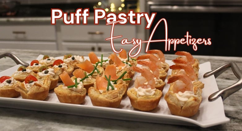 a platter of appetizing food with made with puff pastry and shrimp, chicken and smoke salmon