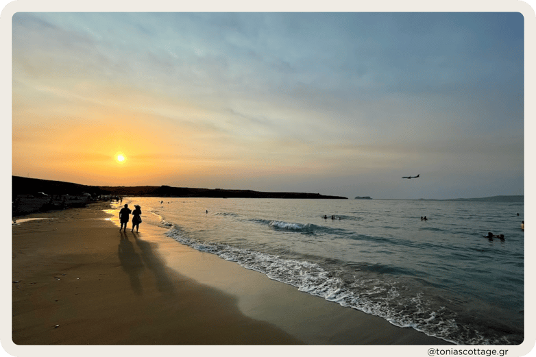 Sunset at Kokkini Hani Beach, Crete, Greece, casting a warm glow over the serene coastline