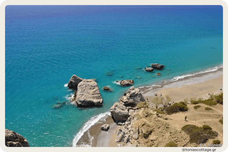 Large rocks and the serene seashore of Listis Beach, Crete, Greece