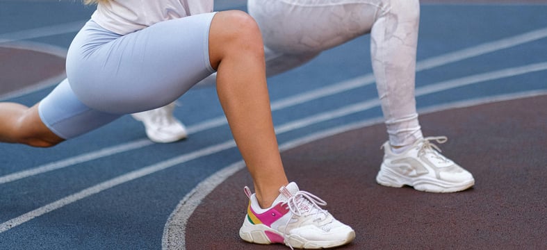 Women stretching as part of a fertility-friendly fitness routine