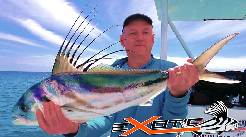 a man holding a fish fish on a boat