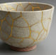 Mended ceramic bowl, symbolizing wholeness and natural resilience