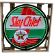 a sky chief neon sign with a sky chief,sky chief sign,sign,texaco sign,