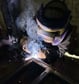 a man welding a piece of steel