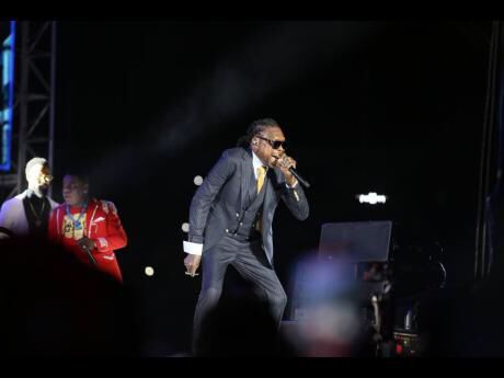 Vybz Kartel in a performance on stage.