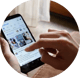Person using a tablet, only the persons hands are visible