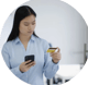 Women holding her mobile phone while looking at her bank card