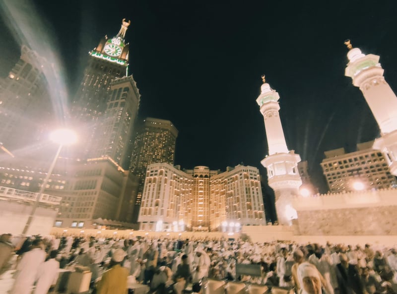 Night view of Abraj Al-Bait and Masjidil Haram minarets