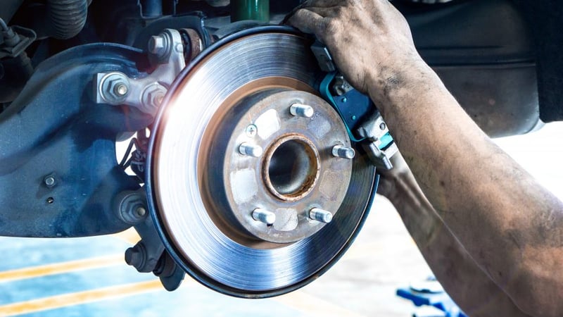 Brake pad and rotor service being performed on a vehicle at Adams Concierge Auto in Wesley Chapel, FL