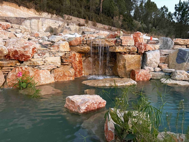 Lisbon Natural Pool Oasis at night with underwater lighting