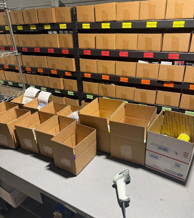 Inside 365PrepCenter warehouse — shelves of inventory ready for FBA