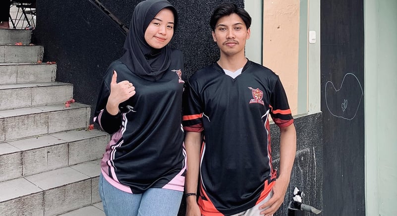a man and woman standing next to each other