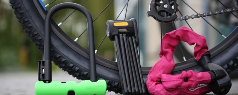 a bicycle with a pink bag on the ground