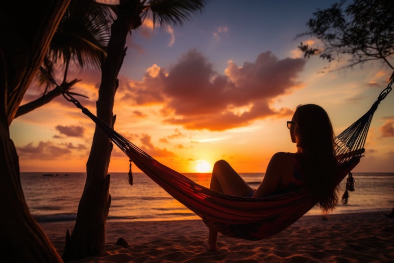 a woman sitting in a hammock in miches