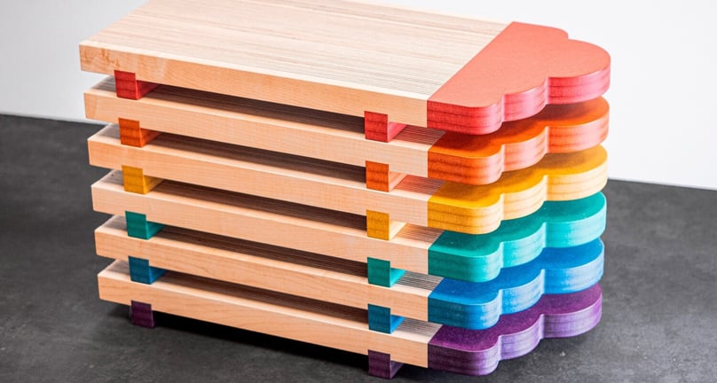 Serving boards created with scrap wood and colored MDF, perfect for cheese or sushi boards