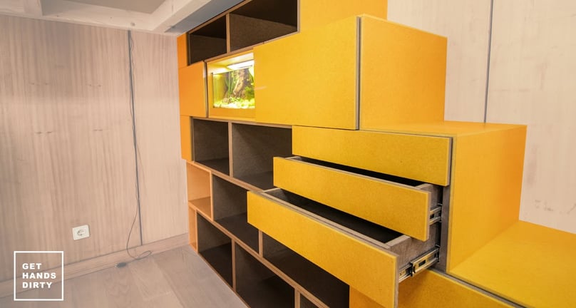 Multi-functional staircase. Built-in cabinets in the side of the stairs. All made of colored MDF.