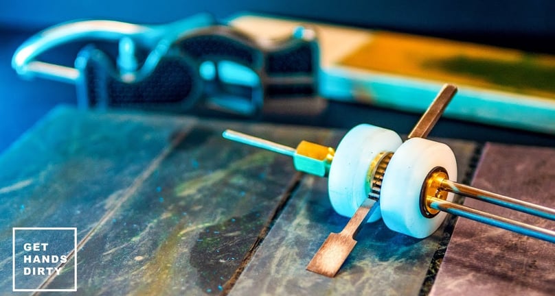 A woodworking tool being sharpened