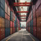 Multiple stacked shipping containers in various colors, including red, green, blue, and orange. The containers are branded with names such as Hapag-Lloyd and China Shipping, and they are stacked on a freight train.