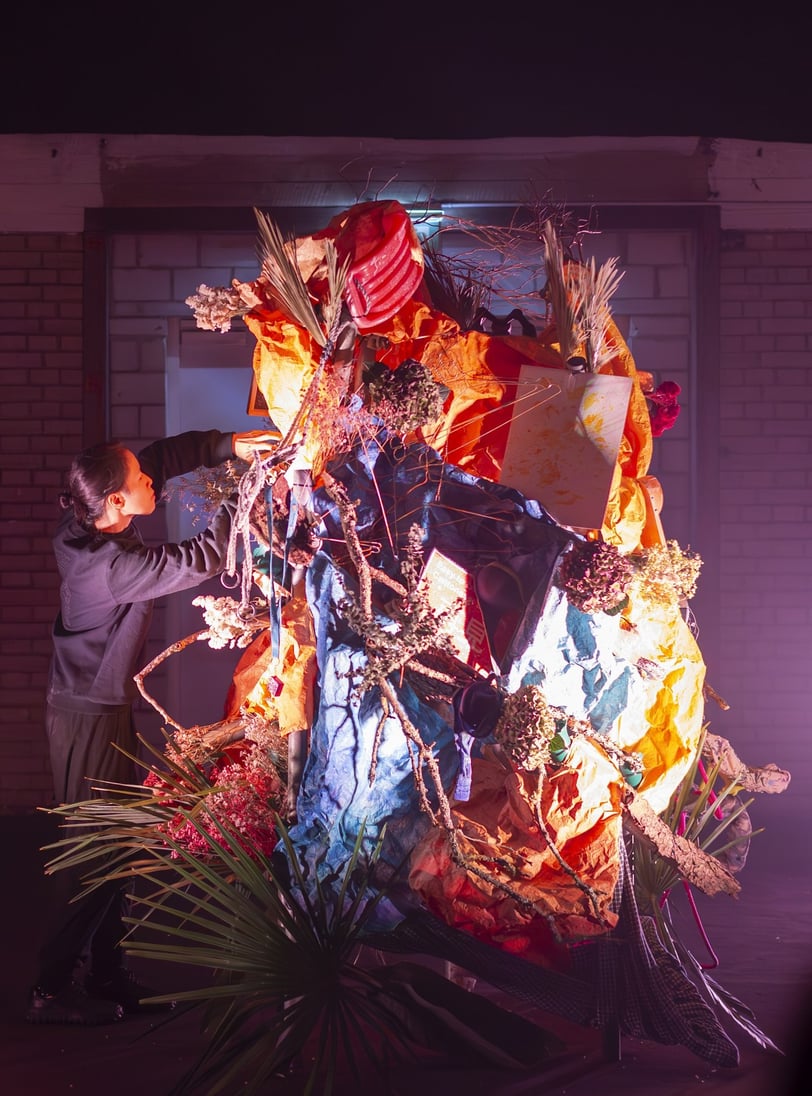 Close-up of community-collected objects in 'Menhir Tapestry 1' ikebana performance