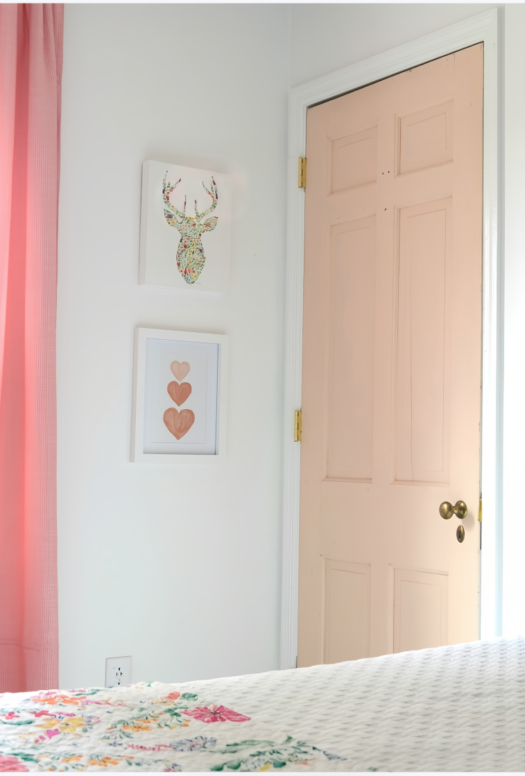 peach bedroom door with gold hardware