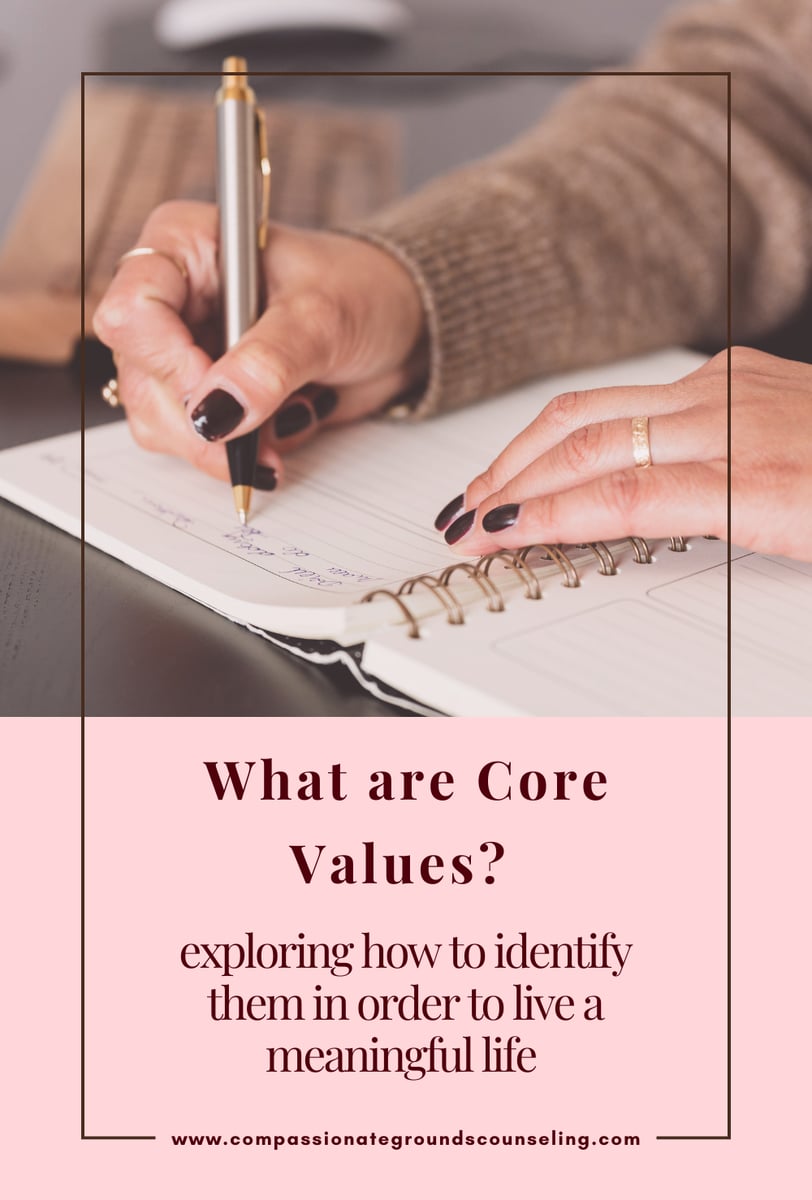 woman using journal to identify core values