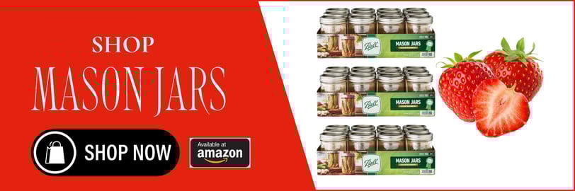 a strawberry cream jar with a strawberry on top of it and a strawberry on the