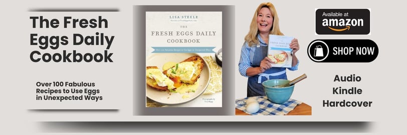 a woman holding a book and a cookbook