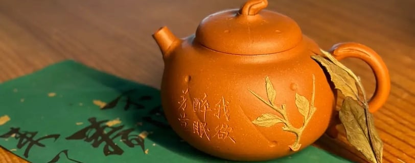 A brown teapot placed on green paper with text written on it