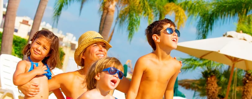a family standing around a pool in punta cana