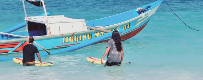 a man and woman are standing in the water