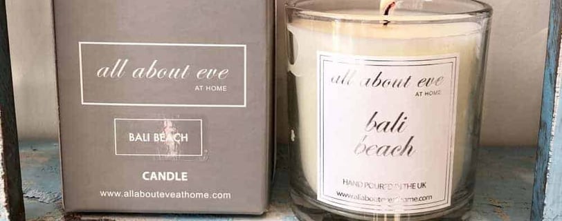 a candle that is sitting on a shelf