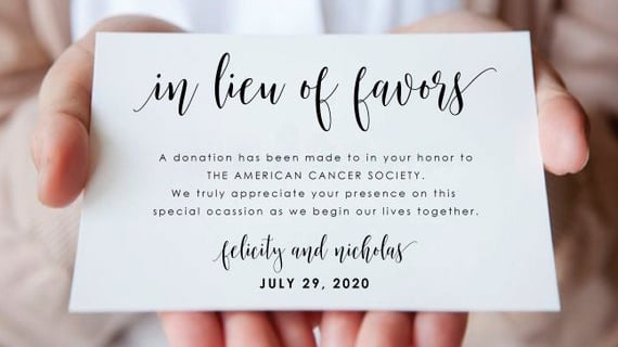 a person holding a wedding donation card