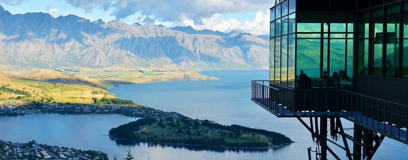 a view of a mountain range with a view of a lake and mountains