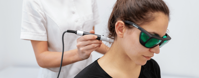 Laser therapy on patient's neck