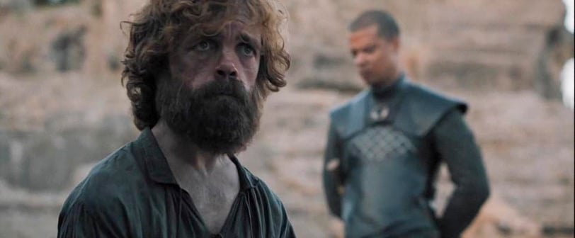 Tyrion Lannister standing in front of the council