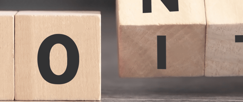 a person holding a wooden block with the words don't do it