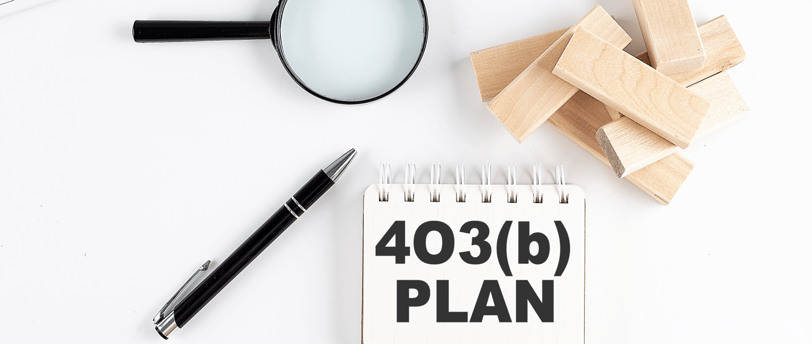 magnifying glass a pen and blocks for 403b plans