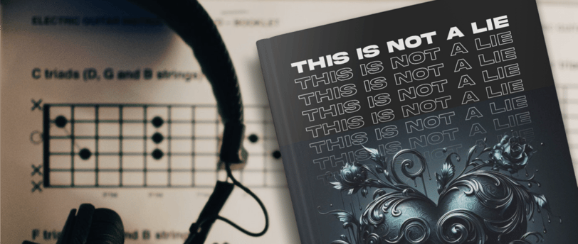 A book with a black cover featuring a black romantic heart lying on a sheet of music next to a pair of headphones